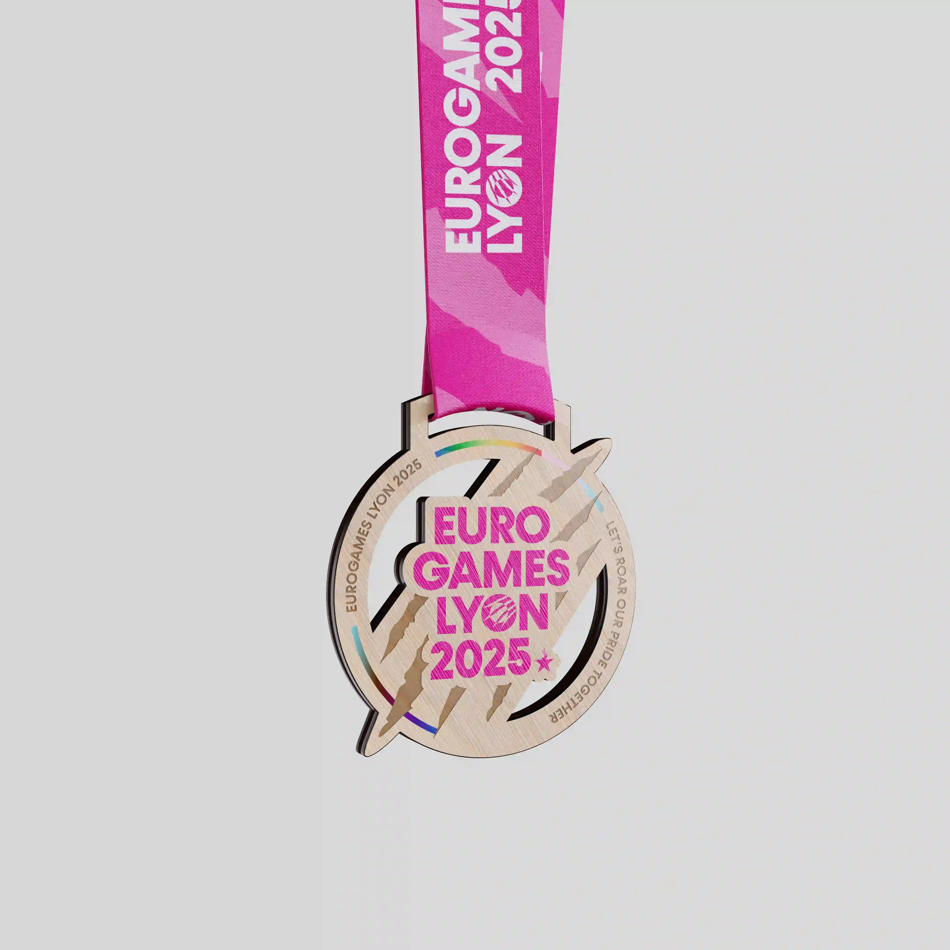 EuroGames Lyon 2025 wood medal with pink graphic centre
