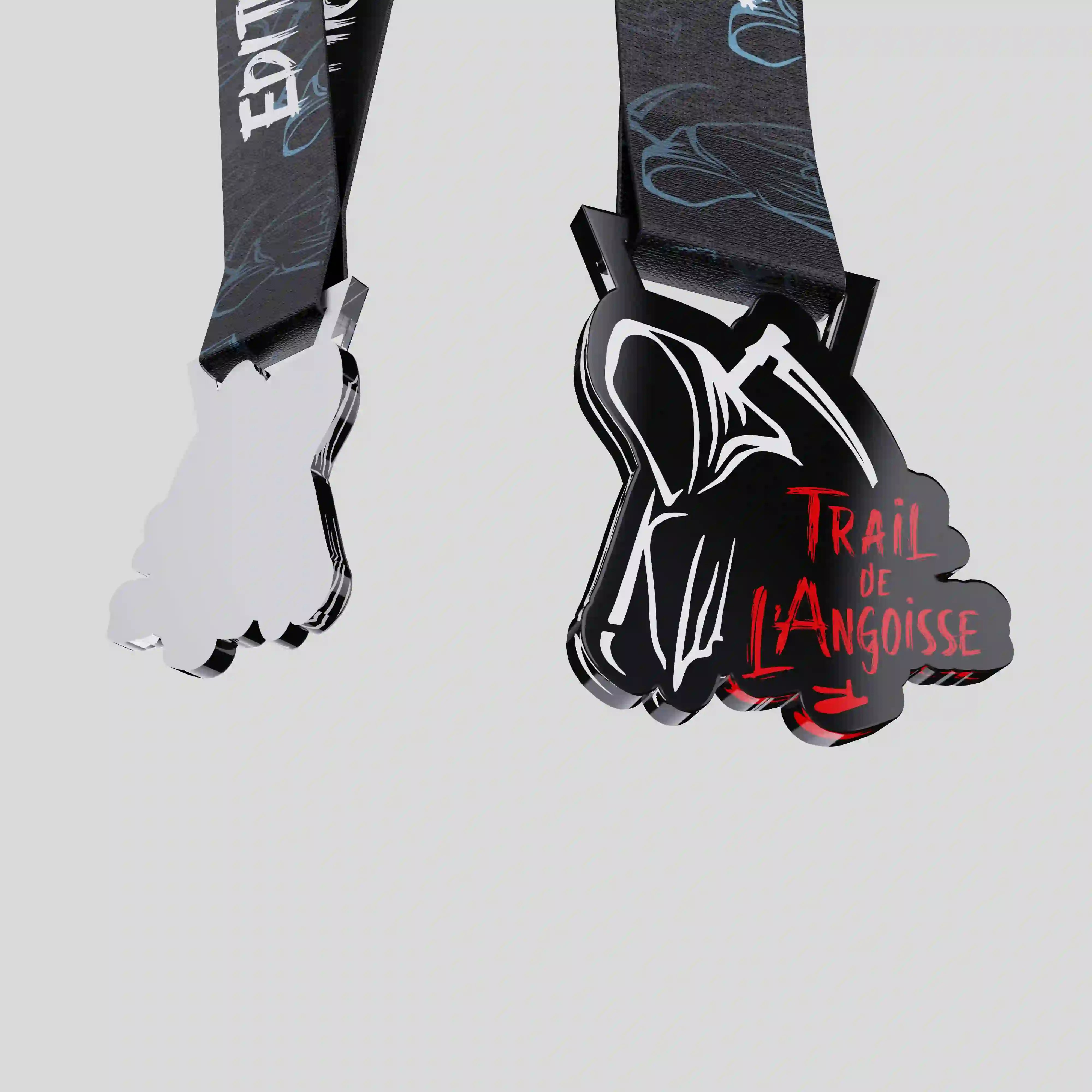 Close-up of the Trail de l’Angoisse acrylic medal showing its cut-out silhouette, glossy finish and dramatic graphic details.