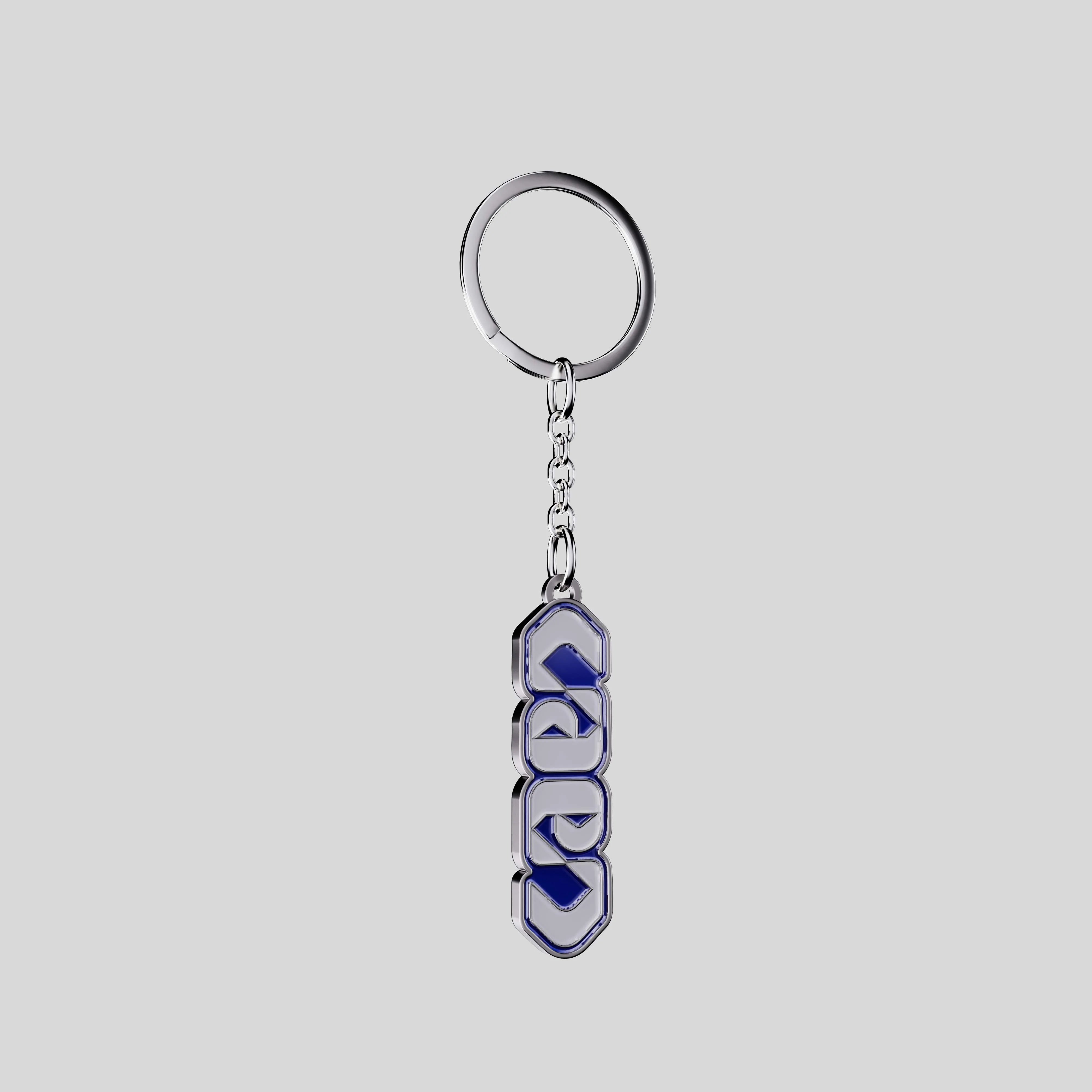 Vertical City of Caen metal keychain with blue enamel letters, front view.