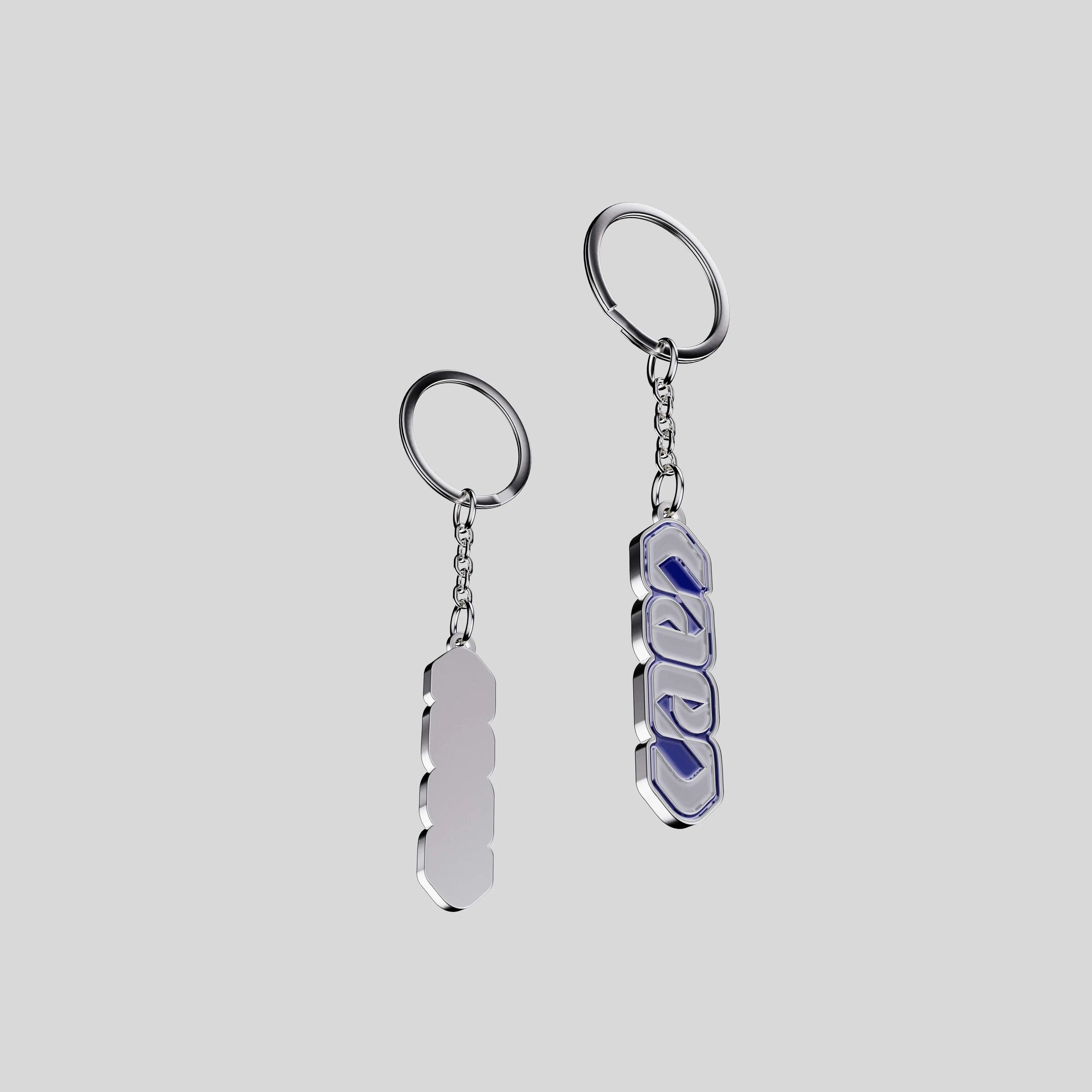 Back view of the City of Caen vertical keychain showing polished metal and chain.