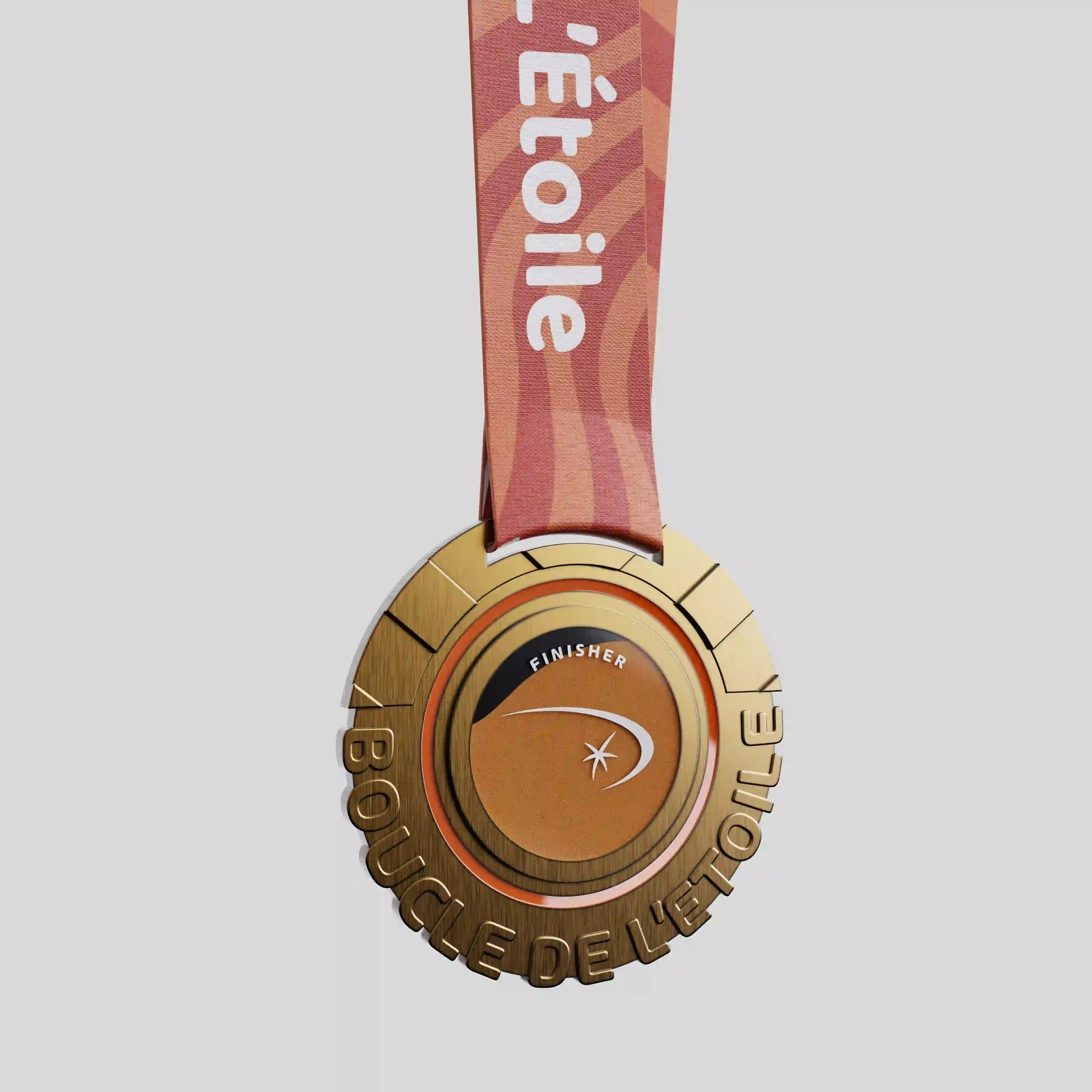 La Boucle de l’Étoile metal finisher medal with gold tones and star logo