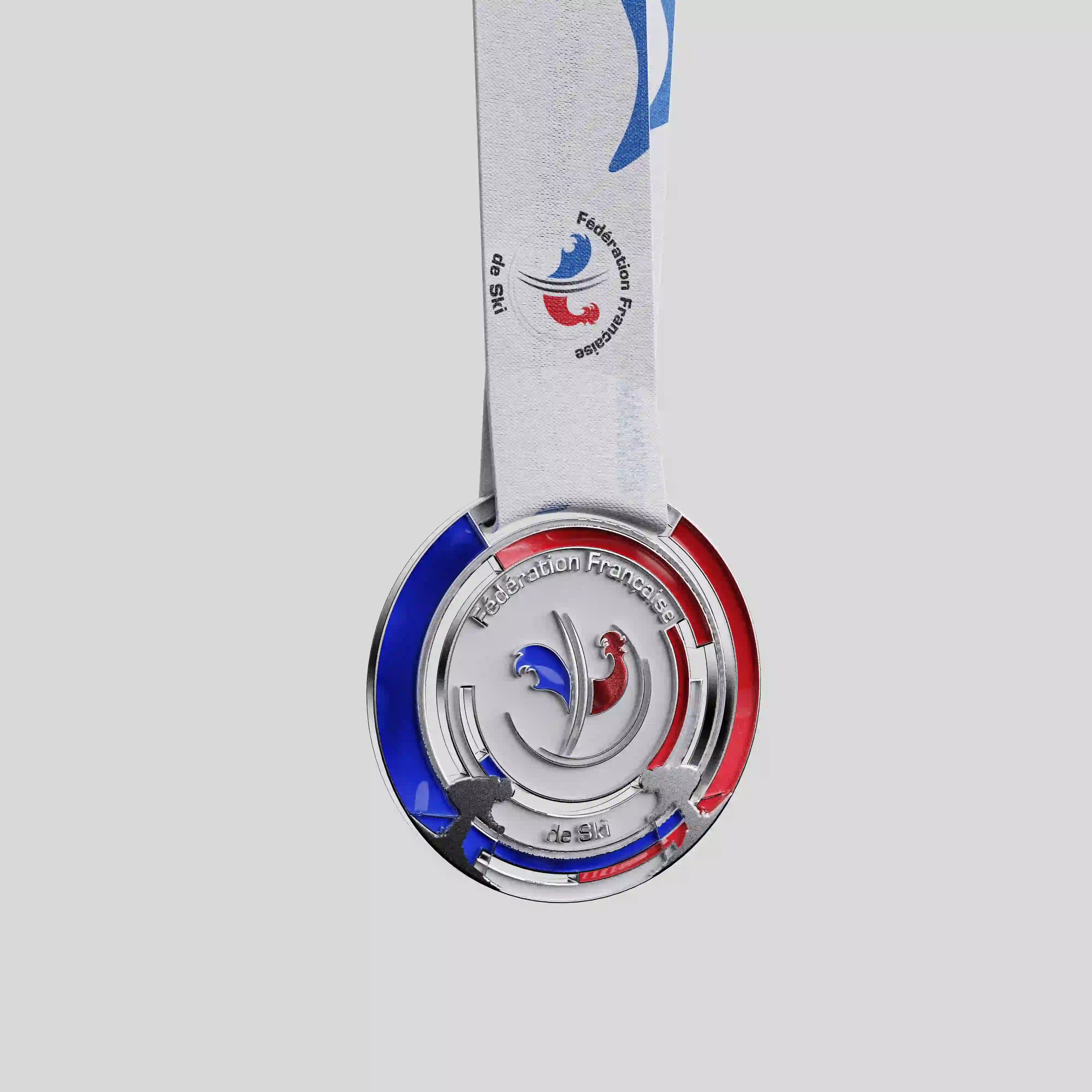 French Ski Federation metal medal with blue and red enamel and skier silhouettes