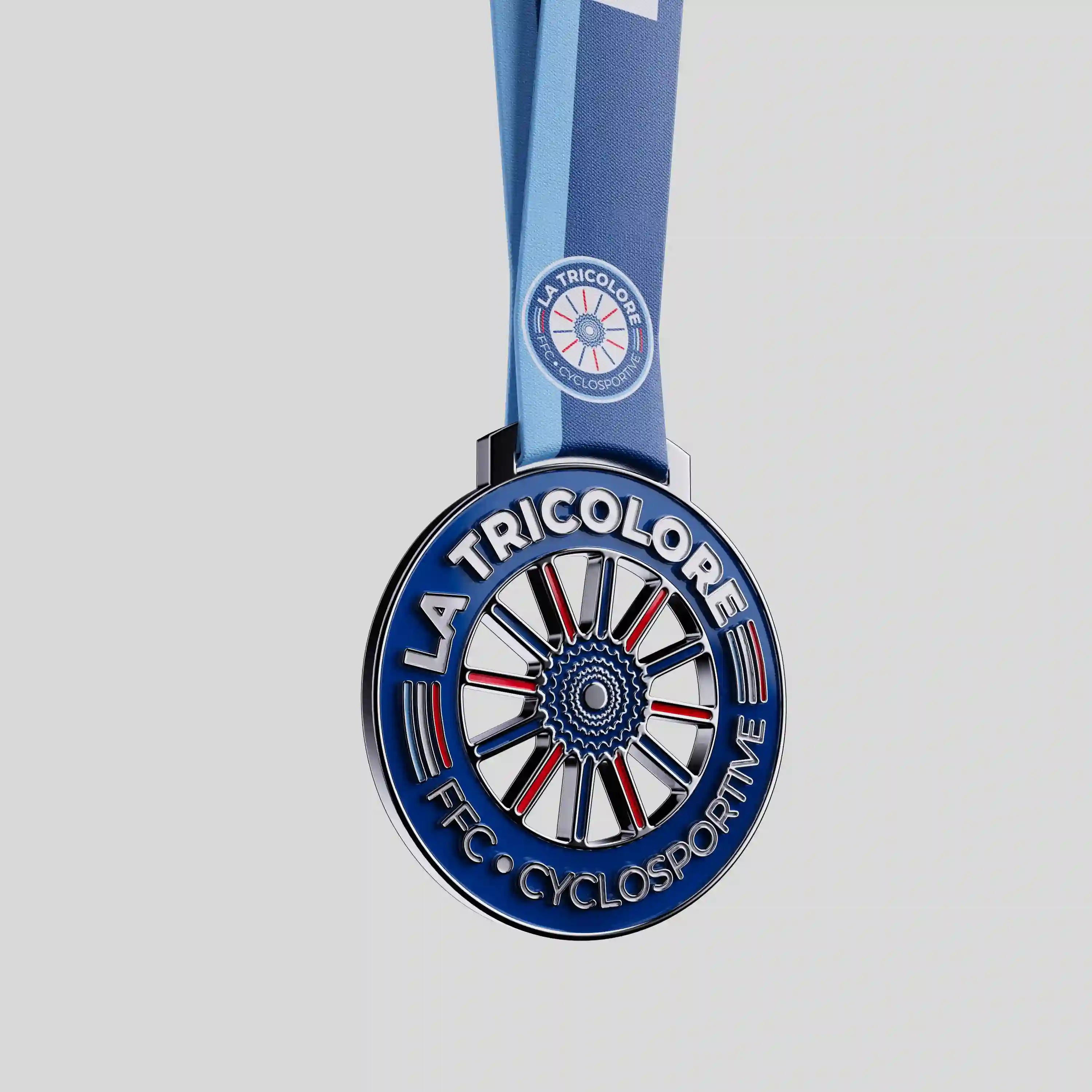 La Tricolore metal medal with blue, white and red cycling wheel design