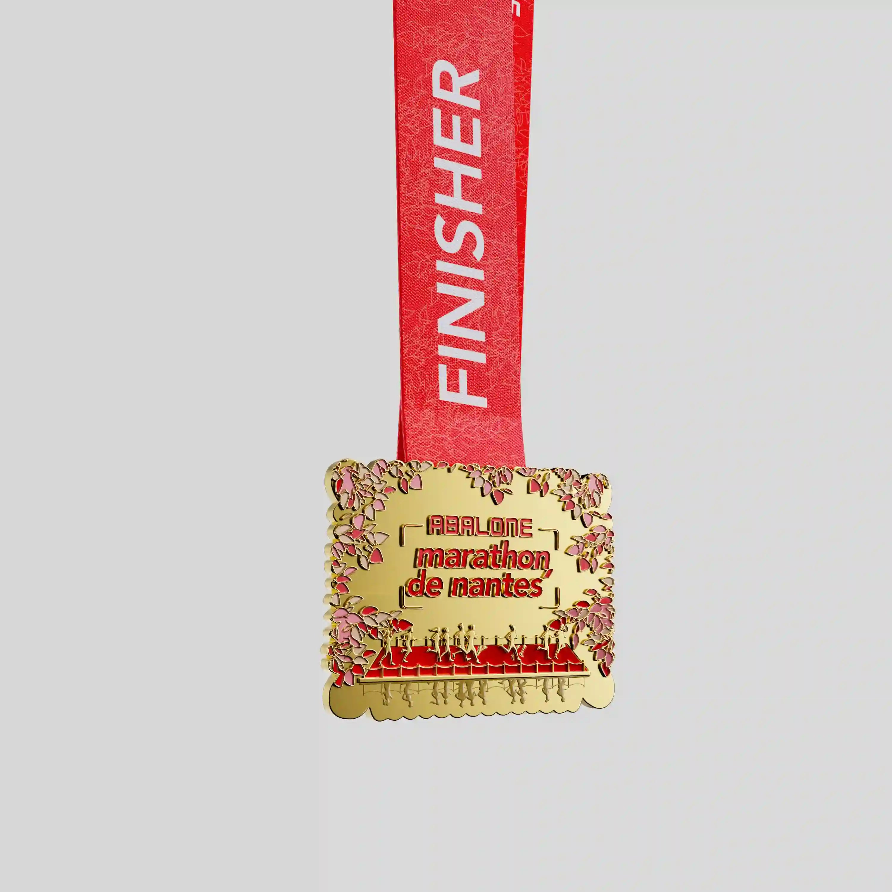 Nantes Marathon gold metal medal with floral border and red ribbon